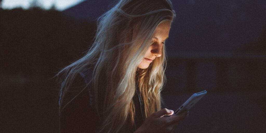 Photo of a woman looking at her phone