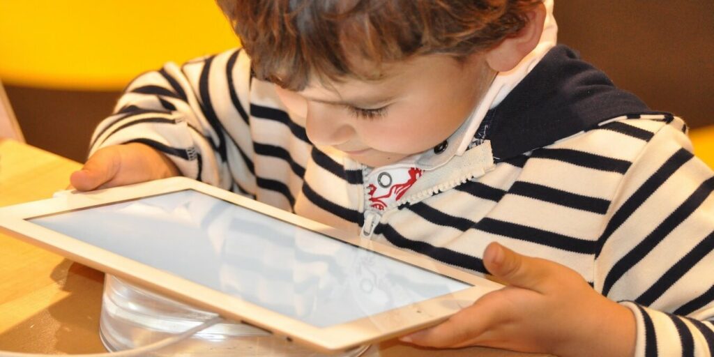 A child using a smart tablet device.